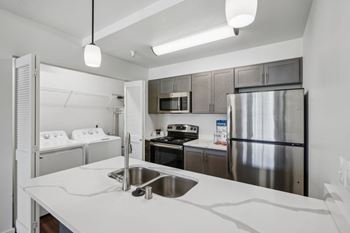 <B>quartz countertops:</b> sleek, durable surfaces with a polished look.